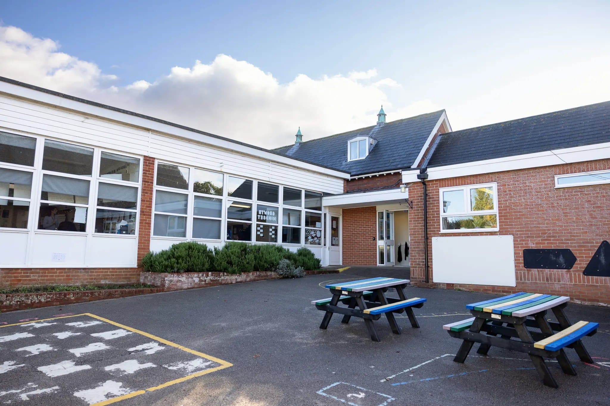 The St Joseph's school building and playground with picnic benches