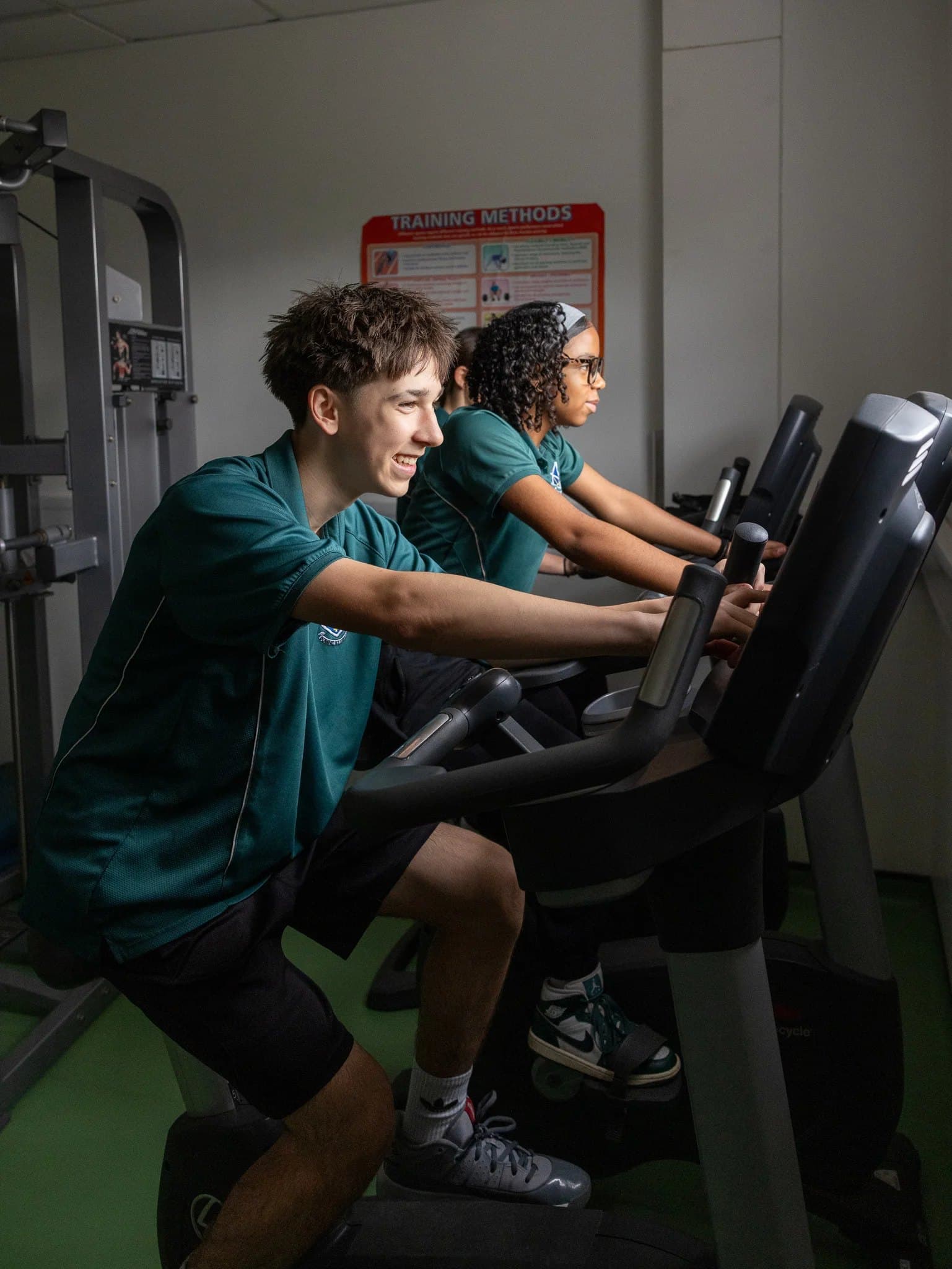 Students working out on exercise bikes in the school gym